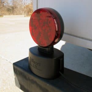 Magnetic tow lights mount onto a variety of metal surfaces